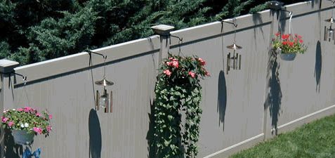 PVC Fence Hangers. Hang plants and other ornamental items on your PVC privacy fence to enhance the look of your outdoor space.